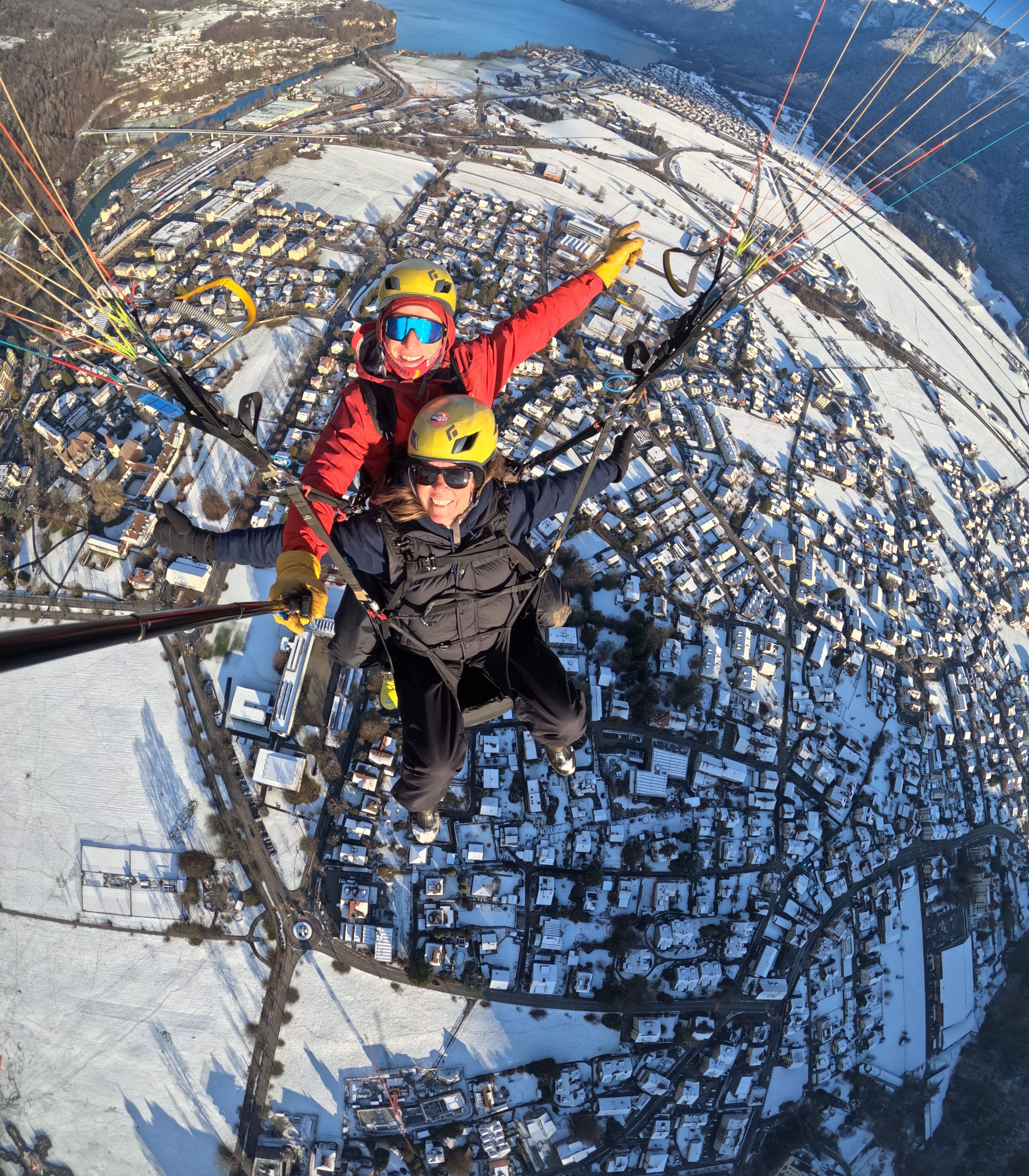 Paragliding adventure over snowy town